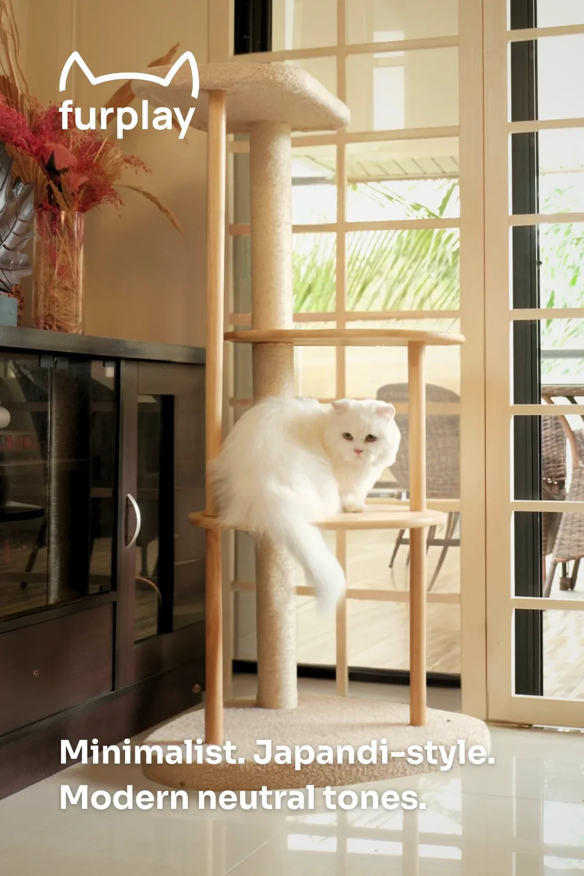 White cat using the Furplay Cat Tree in a warm home setting